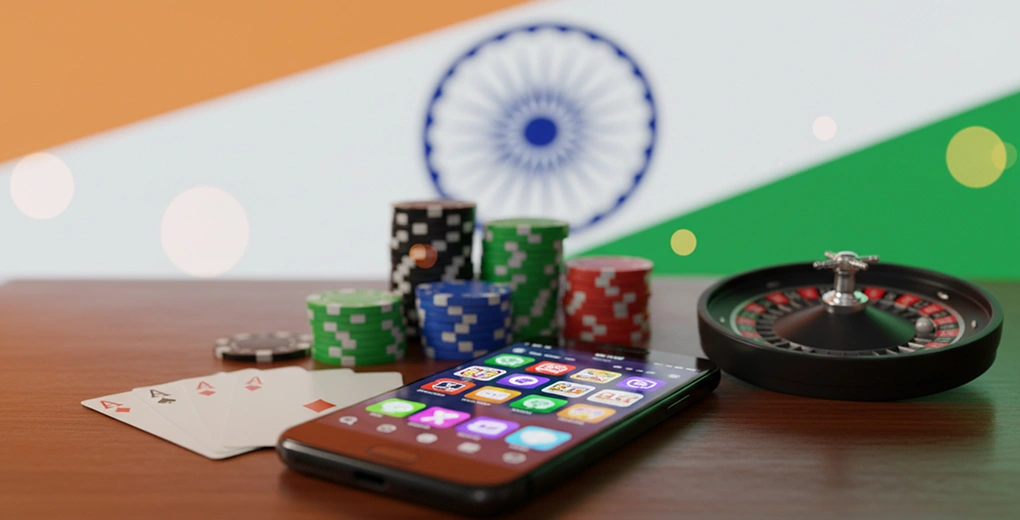 Casino chips, playing cards next to smartphone with India flag backdrop